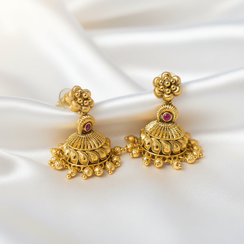 Antique Gold Plated Floral Dome Jhumka Earrings With Ruby Accent