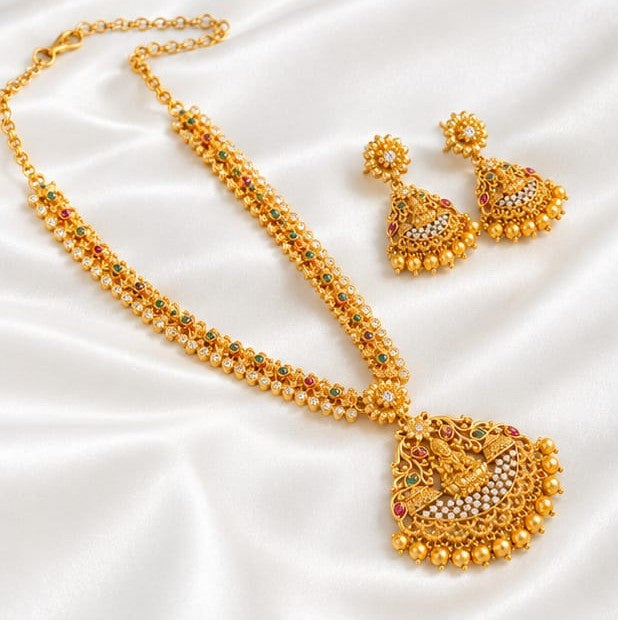 Gold-Plated Temple Lakshmi Long Haram Necklace Set with Ruby, Emerald & CZ Stones and Matching Drop Earrings