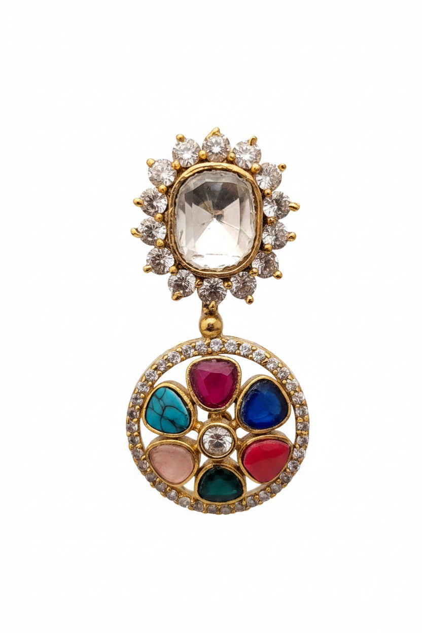 Ornate earring with gemstones on a dark background