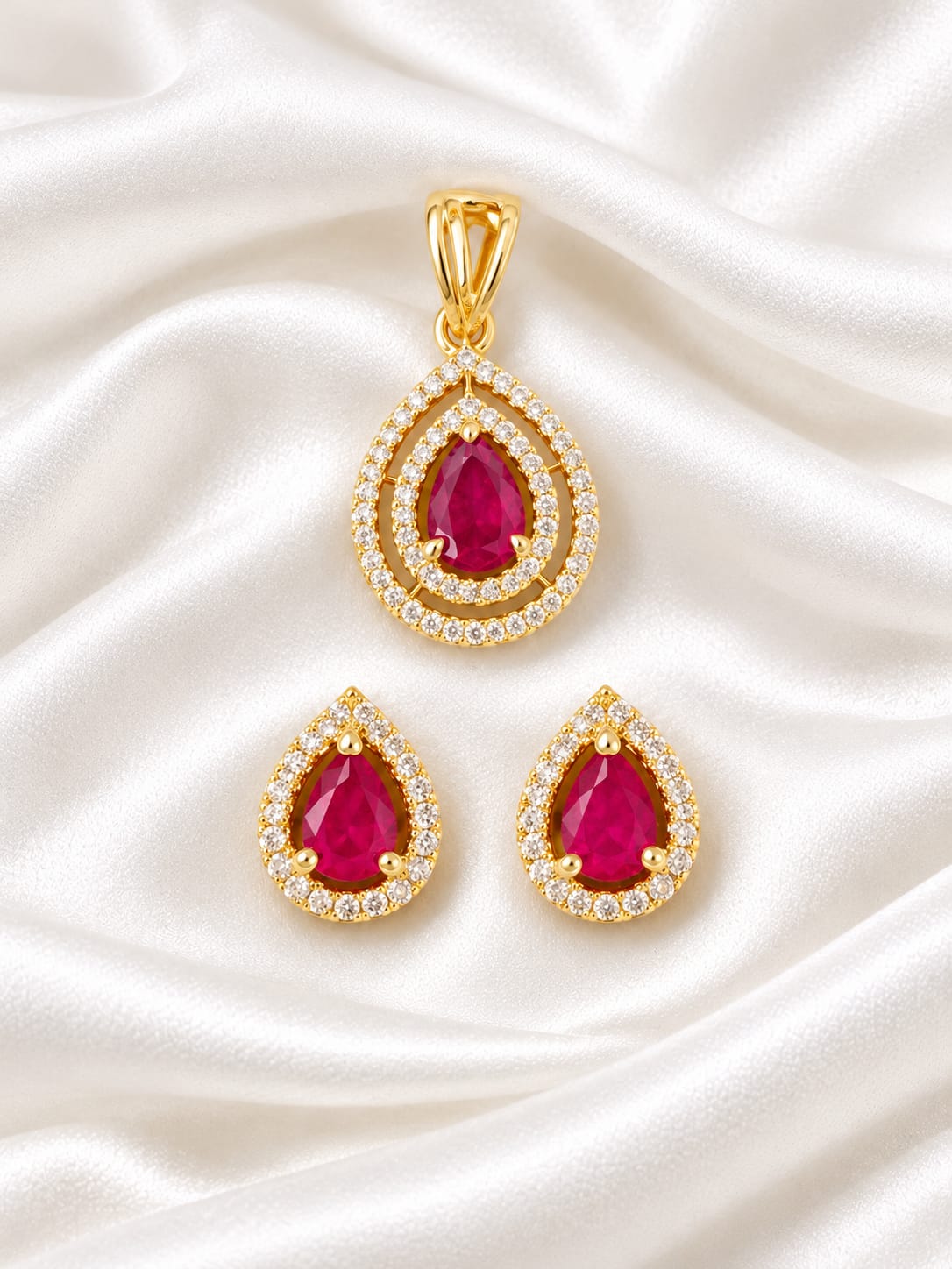 Exquisite Pear-Cut Ruby & Zirconia Double-Halo Pendant and Matching Push-Back Earrings Set in Gold Finish