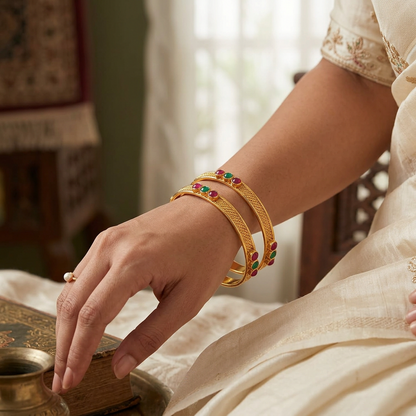 Minimalist Traditional Gold Finish Bangle Pair | Bezel-Set Ruby & Emerald Stones with Braided Texture