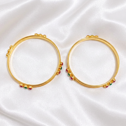Minimalist Traditional Gold Finish Bangle Pair | Bezel-Set Ruby & Emerald Stones with Braided Texture