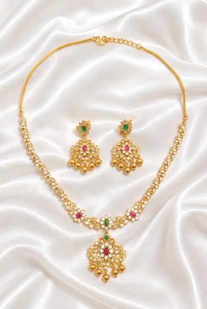 Elegant Matte Gold Floral Unki Pattern Necklace with Ruby & Emerald Kemp Accents